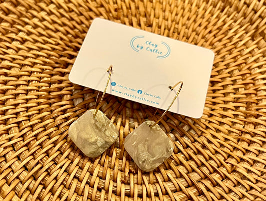 Translucent gold square hoops